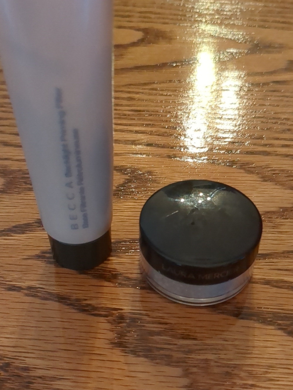 BECCA Radiant Priming Filter And Laura Mercier Setting Powder.